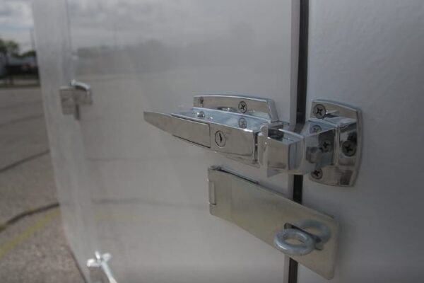 The white door and metal lock of a Polar King walkin cooler