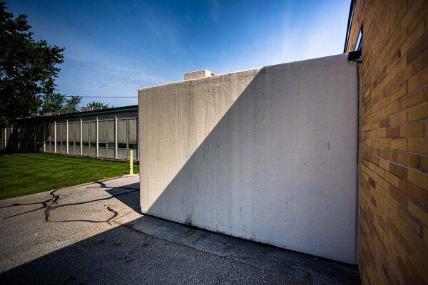 Side view of Polar King walk-in refrigeration unit attached to brick building