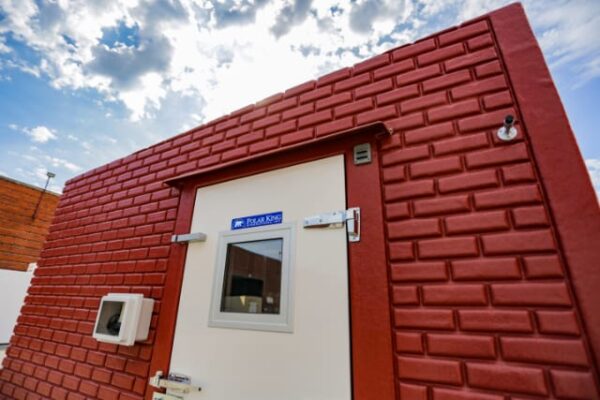 Brick exterior of Polar King walk-in freezer unit