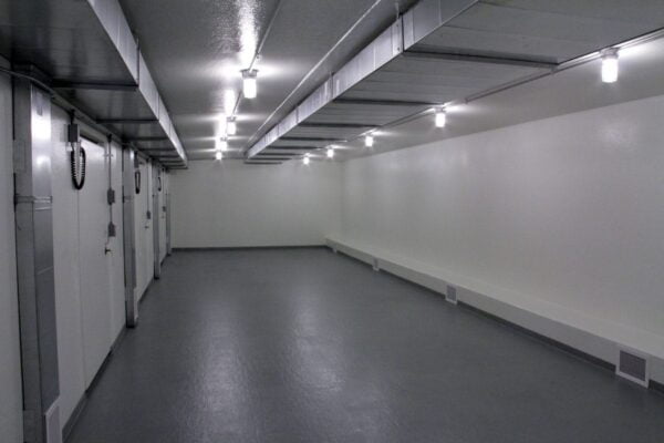 Grey floors and white walls inside a refrigerated building
