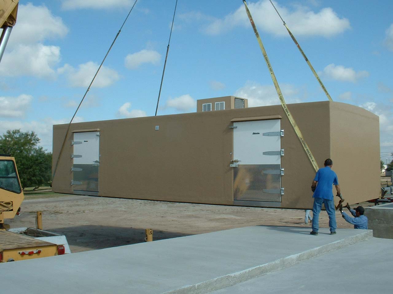 Tan Polar King walk-in cooler unit being delivered