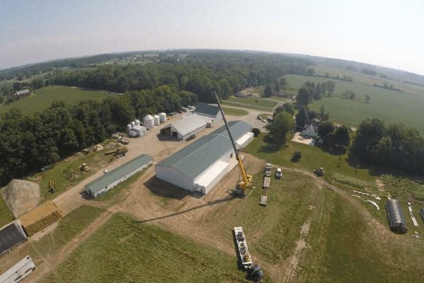 Aerial view of Seven Sons Farm and a crane lifting a walk-in cooler freezer unit